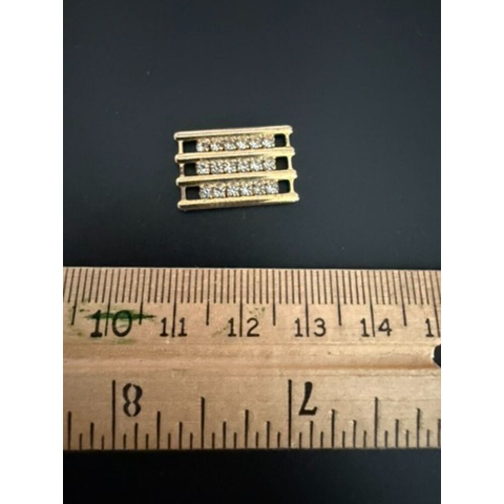 Unsure what this is... gold toned metal with clear stones found in old jewelry b